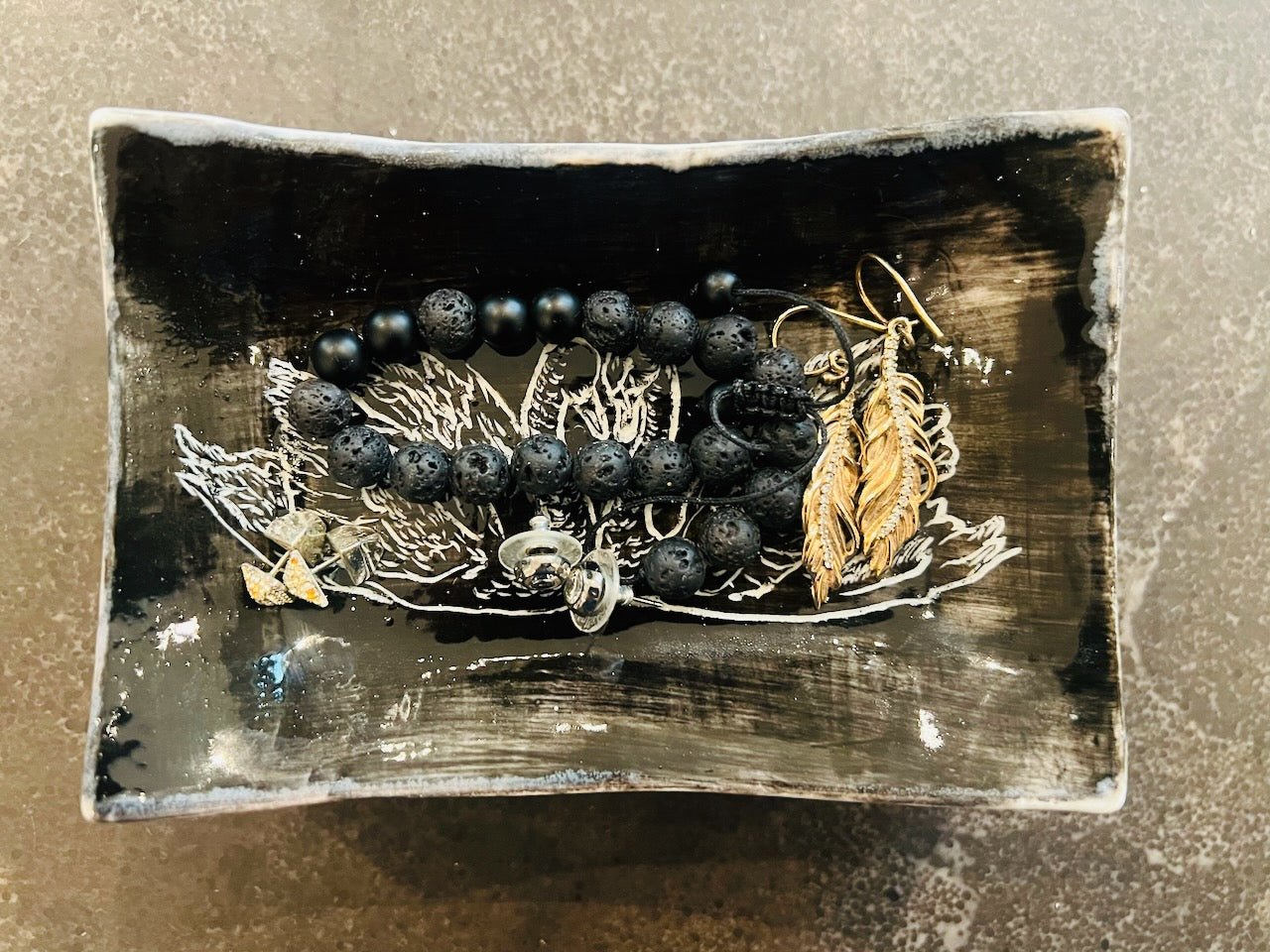Used as a jewelry dish or catchall